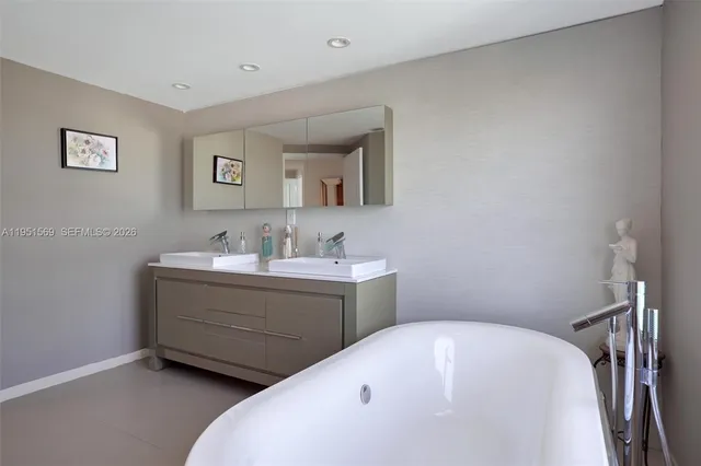 a bathroom with a bathtub and shower