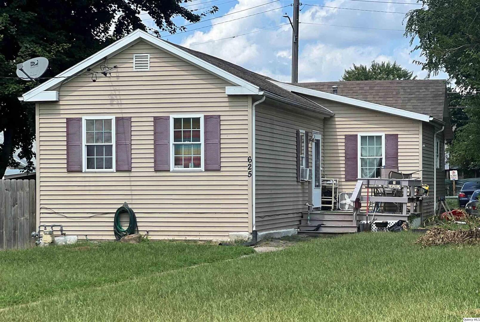 625 Payson Avenue Quincy, IL 62301 - Photo 1 of 3 a front view of a house with a garden