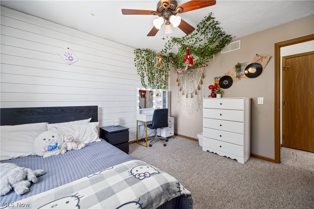 684 Guilford Road Vermilion, OH 44089 - Photo 28 of 37 Carpeted bedroom with ceiling fan