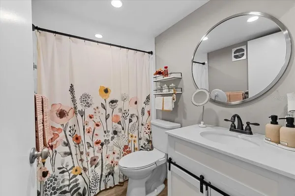 a bedroom with a bed and a table in it