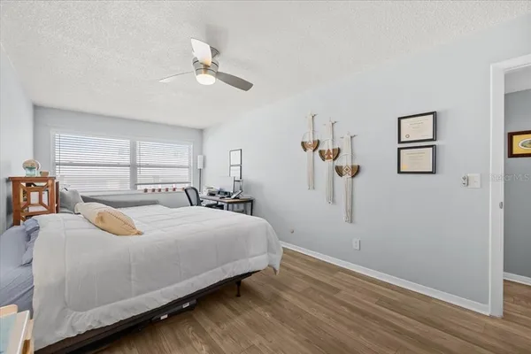 a bedroom with furniture and a book shelf