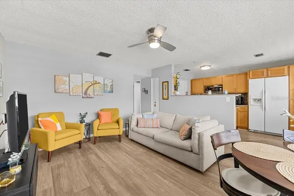 a kitchen with stainless steel appliances granite countertop a stove and a refrigerator