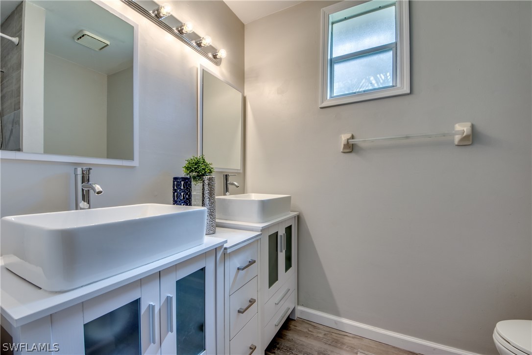 18372 Hawthorne Road Fort Myers, FL 33967 - Photo 13 of 28 a bathroom with a sink and a mirror