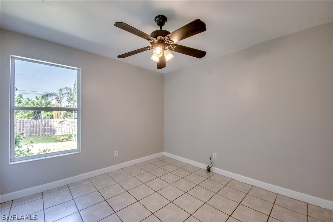 18372 Hawthorne Road Fort Myers, FL 33967 - Photo 19 of 28 wooden floor in an empty room with a window