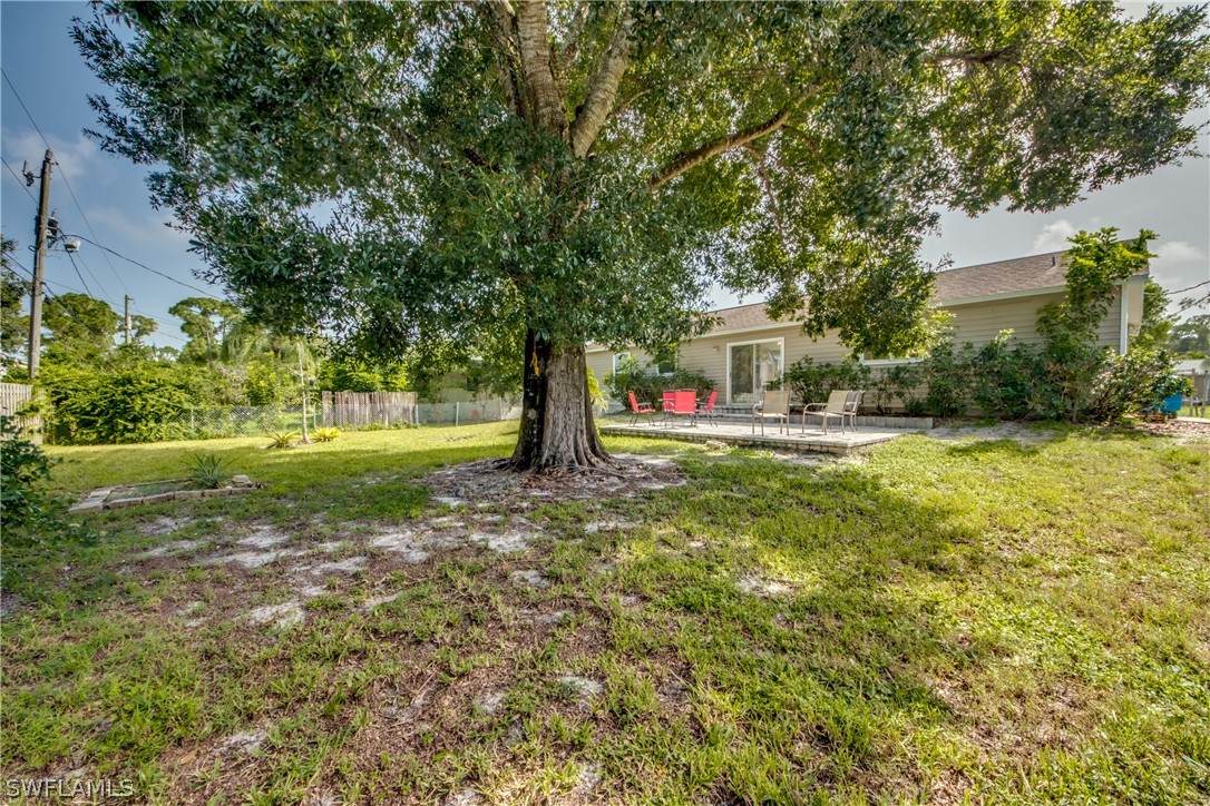 18372 Hawthorne Road Fort Myers, FL 33967 - Photo 27 of 28 a view of a house with a yard and tree s