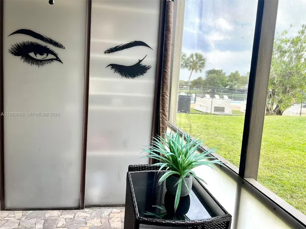 a view of a potted plant next to a window