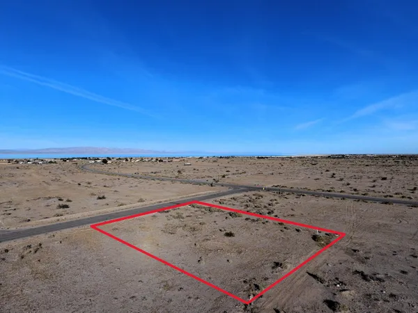 an aerial view of an ocean beach