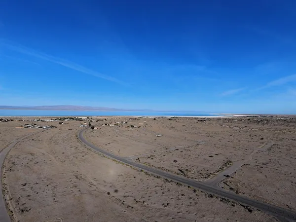 a view of a street with an ocean view