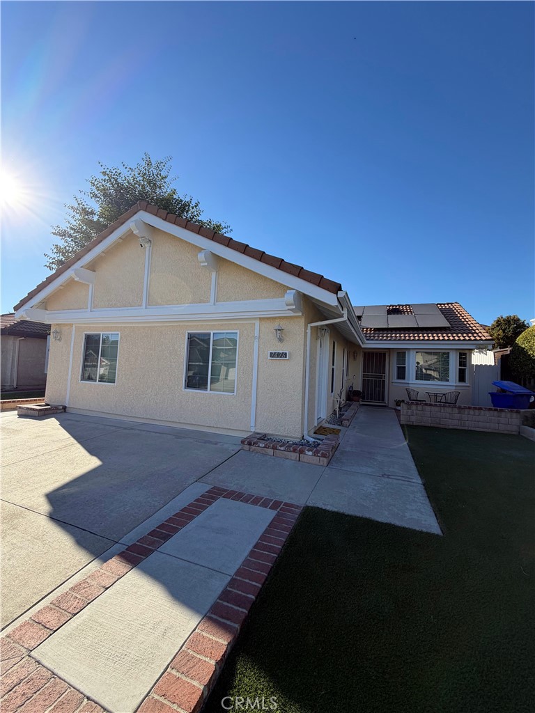 7476 Brookside Road Rancho Cucamonga, CA 91730 - Photo 2 of 13 a front view of a house with a yard