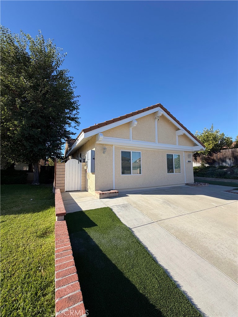7476 Brookside Road Rancho Cucamonga, CA 91730 - Photo 4 of 13 a front view of house with yard and trees