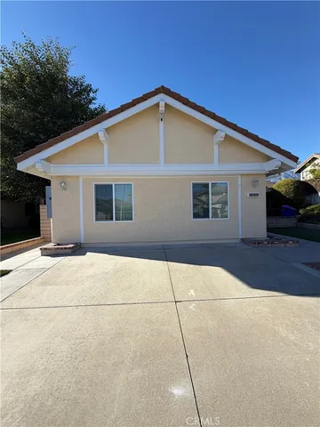 a backyard of a house with yard and garage