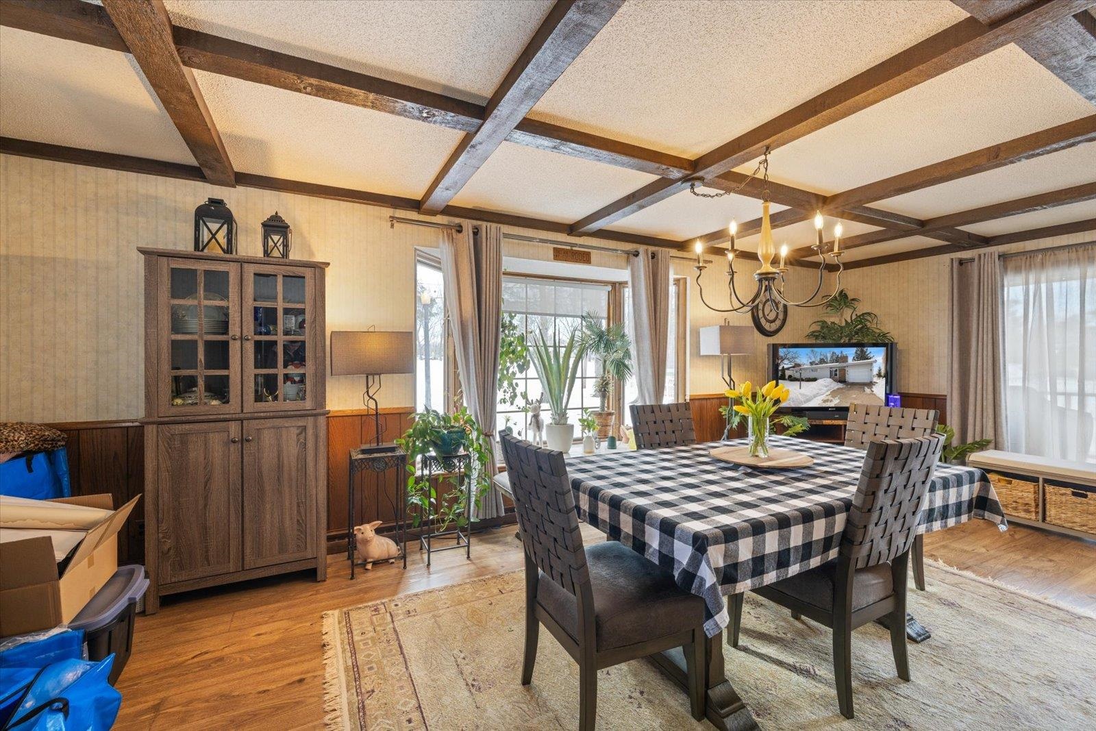 502 North Inner Drive Hibbing, MN 55746 - Photo 23 of 57 Dining space featuring wainscoting, wooden walls, wallpapered walls, light wood finished floors, and suspended lighting