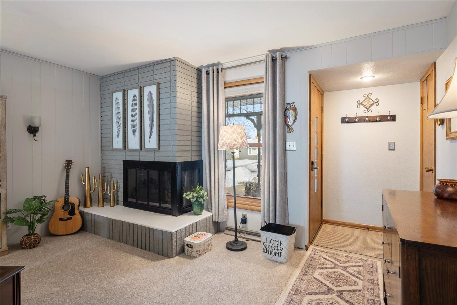 502 North Inner Drive Hibbing, MN 55746 - Photo 30 of 57 Living room featuring a brick fireplace and light carpet