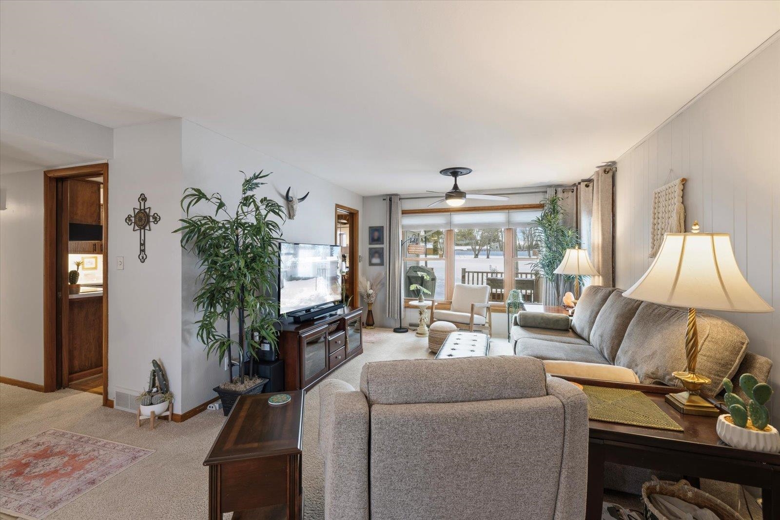 502 North Inner Drive Hibbing, MN 55746 - Photo 31 of 57 Carpeted living area featuring ceiling fan and baseboards