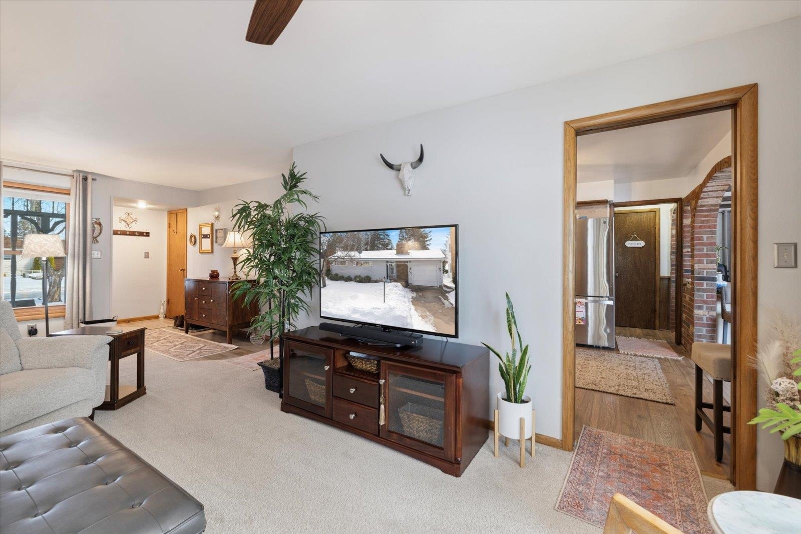 502 North Inner Drive Hibbing, MN 55746 - Photo 32 of 57 Carpeted living area with a ceiling fan and baseboards
