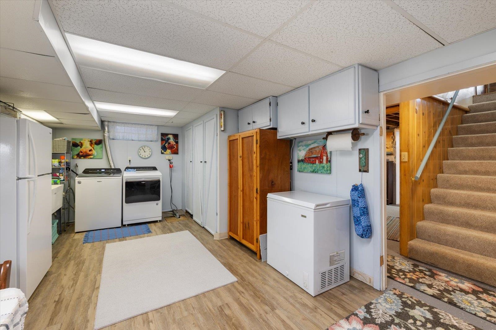 502 North Inner Drive Hibbing, MN 55746 - Photo 49 of 57 Laundry area featuring a paneled ceiling, light wood-style floors, and washing machine and dryer