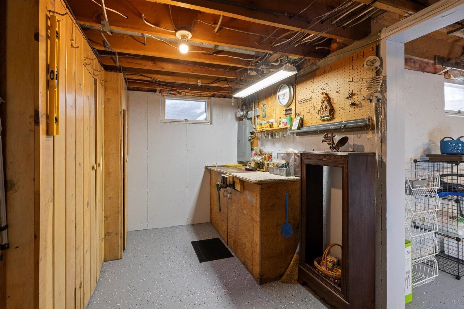 502 North Inner Drive Hibbing, MN 55746 - Photo 51 of 57 Bar area featuring a workshop area, wood finish cabinets, open shelves, and electric panel