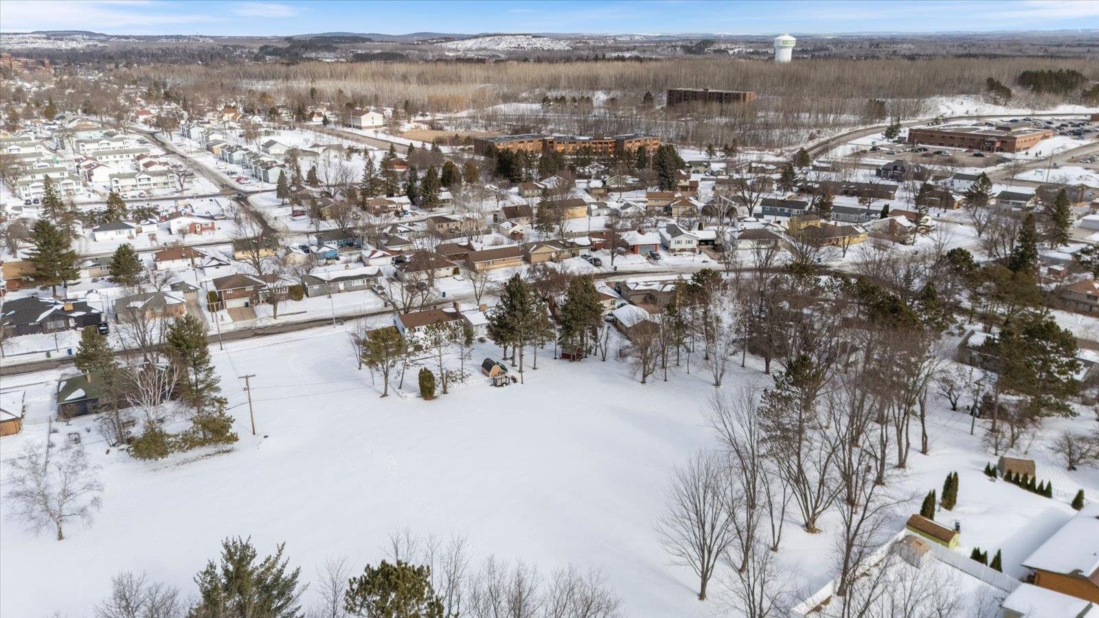 502 North Inner Drive Hibbing, MN 55746 - Photo 9 of 57 Snowy aerial view with a residential view