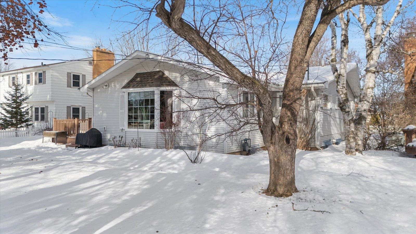 502 North Inner Drive Hibbing, MN 55746 - Photo 10 of 57 Snow covered property with a chimney and a wooden deck