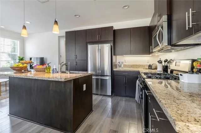 a large bed sitting in a bedroom next to a window