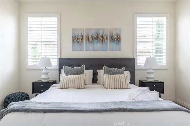 a bedroom with a large bed and a couch