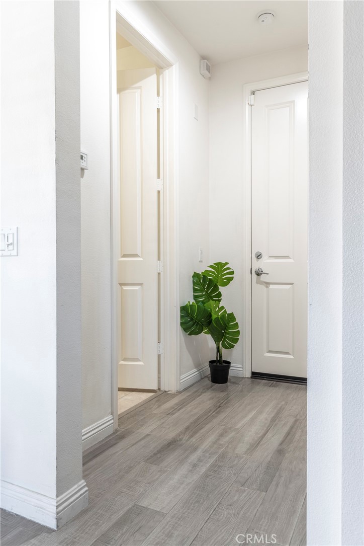 816 East Promenade, Unit A Azusa, CA 91702 - Photo 39 of 75 a view of entryway with wooden floor