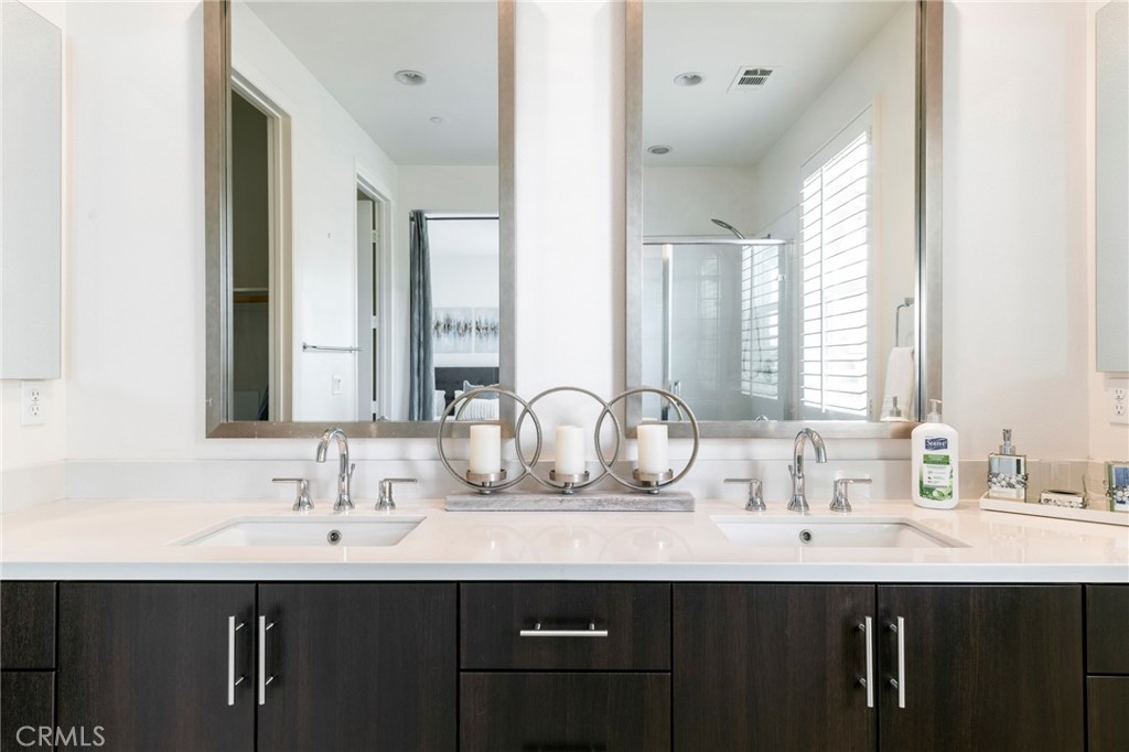 816 East Promenade, Unit A Azusa, CA 91702 - Photo 47 of 75 a bathroom with double sink and a mirror