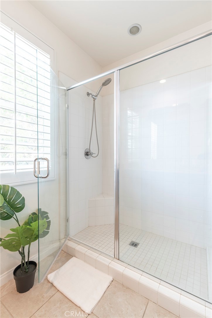 816 East Promenade, Unit A Azusa, CA 91702 - Photo 50 of 75 a bathroom with a shower and a glass door