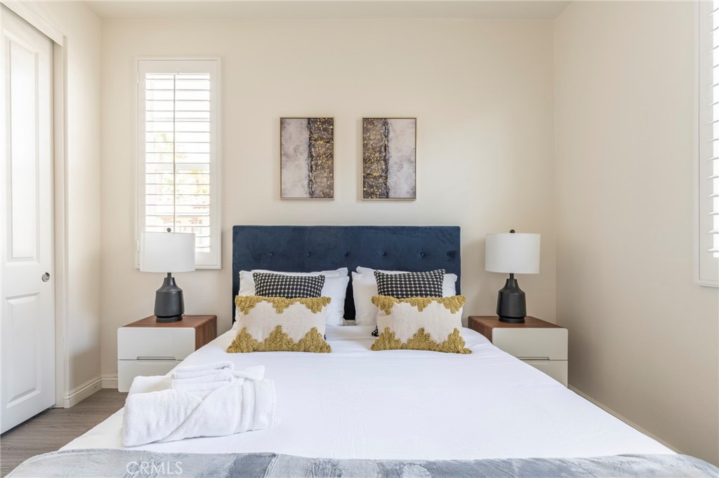 816 East Promenade, Unit A Azusa, CA 91702 - Photo 54 of 75 a bedroom with a large bed and a window