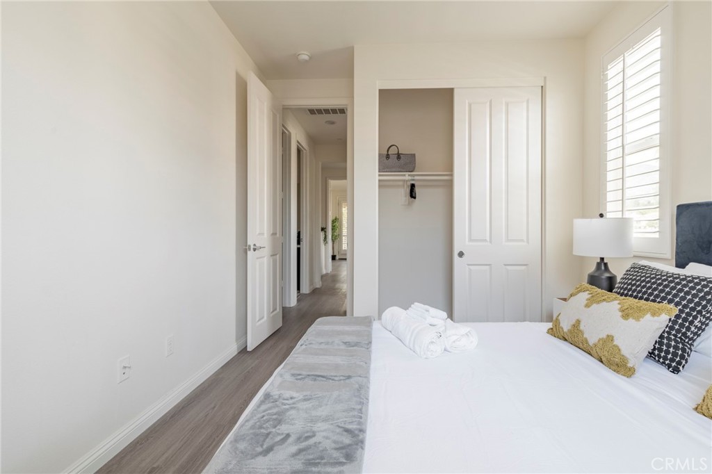 816 East Promenade, Unit A Azusa, CA 91702 - Photo 58 of 75 a bedroom with a bed and a window