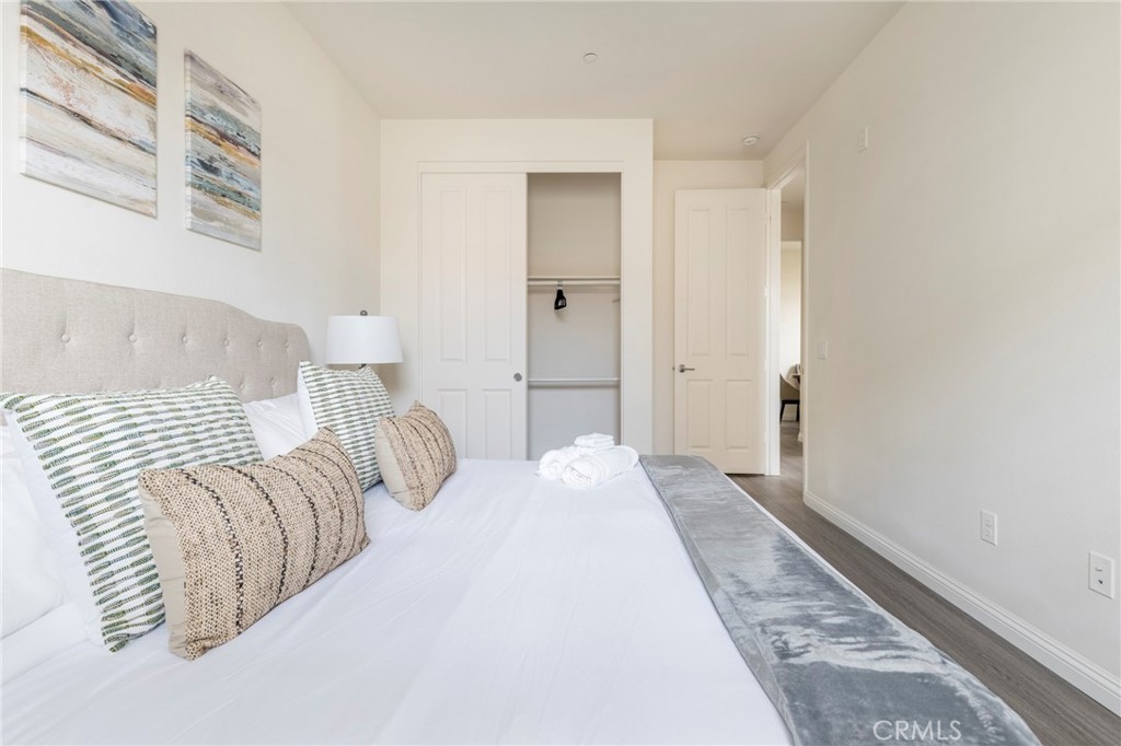 816 East Promenade, Unit A Azusa, CA 91702 - Photo 64 of 75 a bedroom with a bed and a painting on the wall