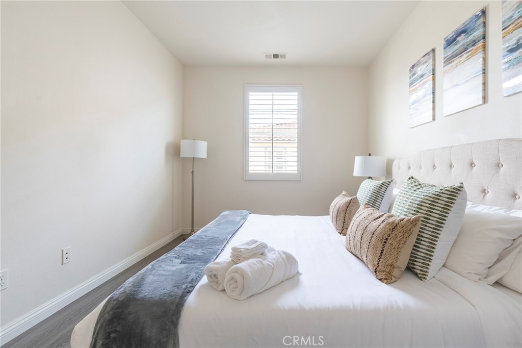 816 East Promenade, Unit A Azusa, CA 91702 - Photo 65 of 75 a bedroom with a bed and a window