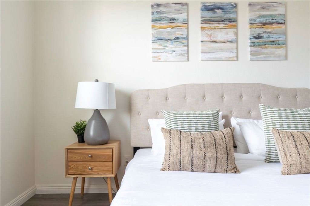 816 East Promenade, Unit A Azusa, CA 91702 - Photo 67 of 75 a bed sitting in a bedroom next to a window with lamp