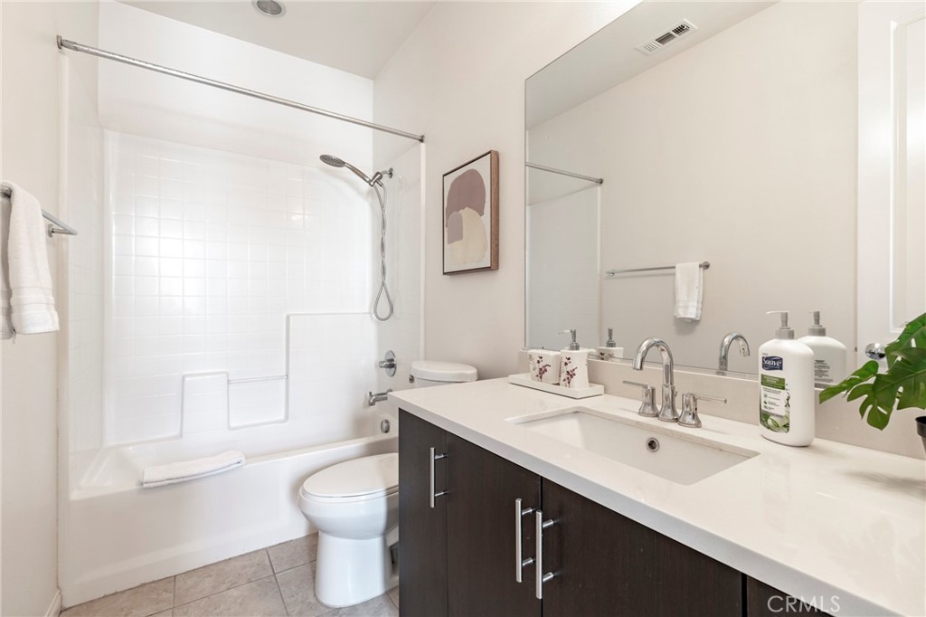 816 East Promenade, Unit A Azusa, CA 91702 - Photo 70 of 75 a bathroom with a sink a toilet and shower