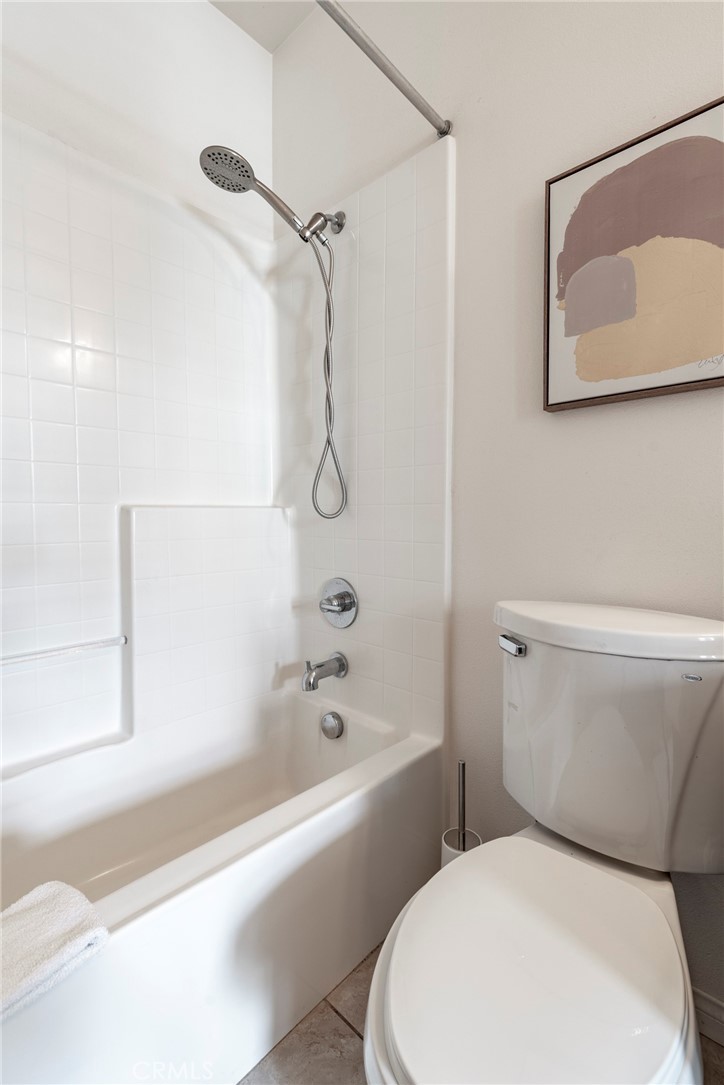 816 East Promenade, Unit A Azusa, CA 91702 - Photo 71 of 75 a white toilet and tub sitting next to a bathroom sink