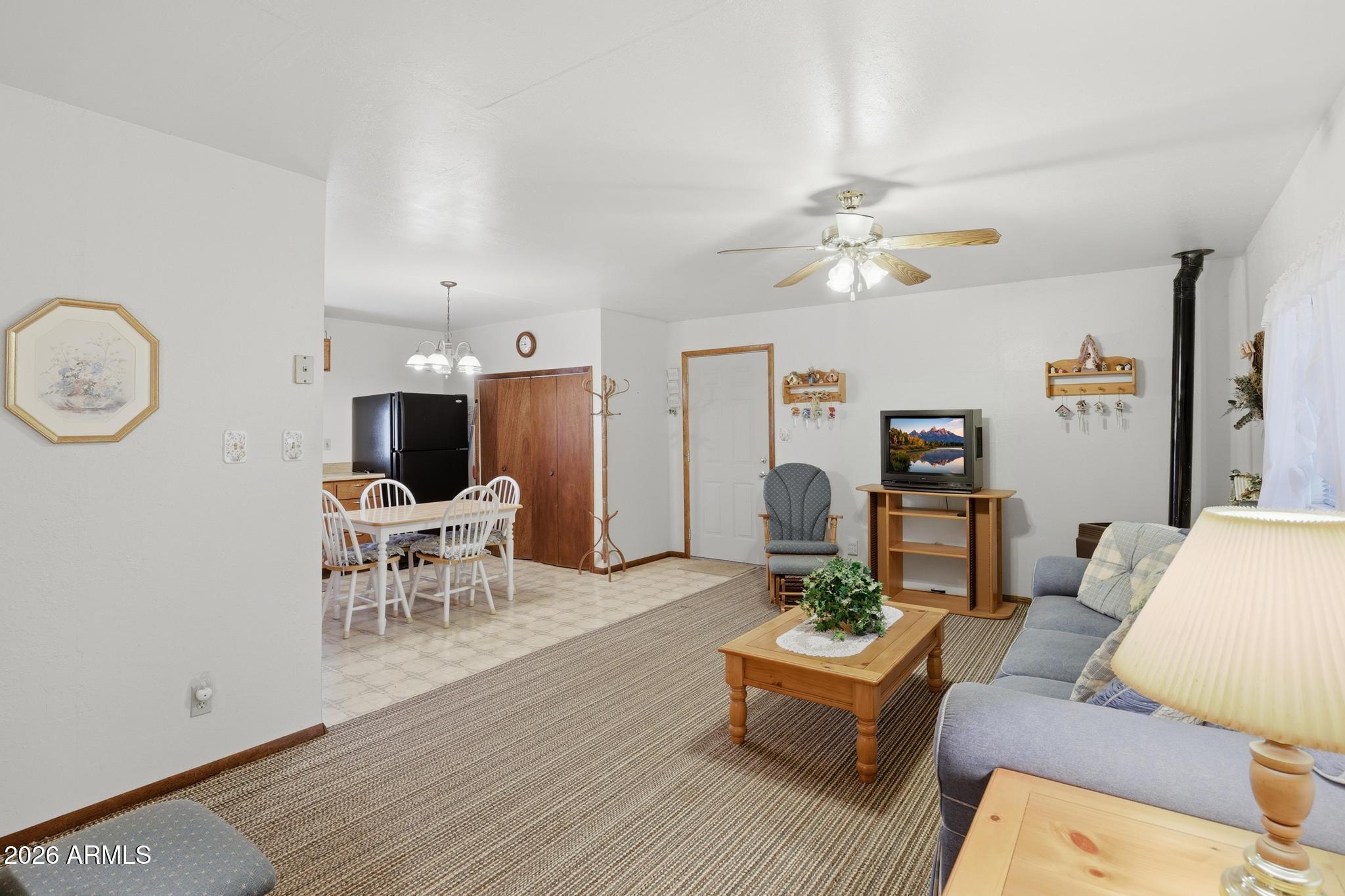 223 Thompson Road Payson, AZ 85541 - Photo 8 of 22 a living room with furniture and a table