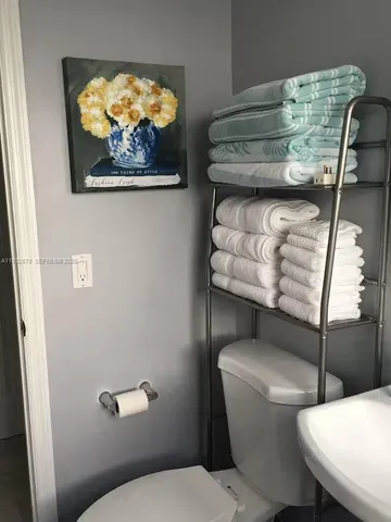 a bathroom with a toilet and a sink