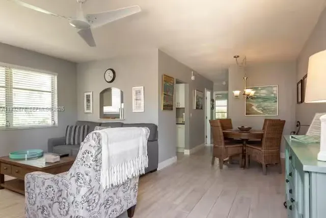 a bedroom with furniture and a large window