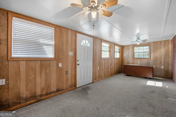 a view of an empty room with a window
