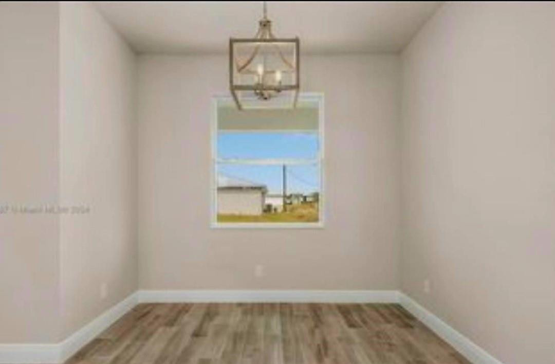 321 Neighborly Road LaBelle, FL 33935 - Photo 11 of 18 an empty room with a window