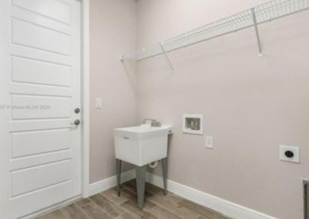 321 Neighborly Road LaBelle, FL 33935 - Photo 15 of 18 a bathroom with a sink and a mirror