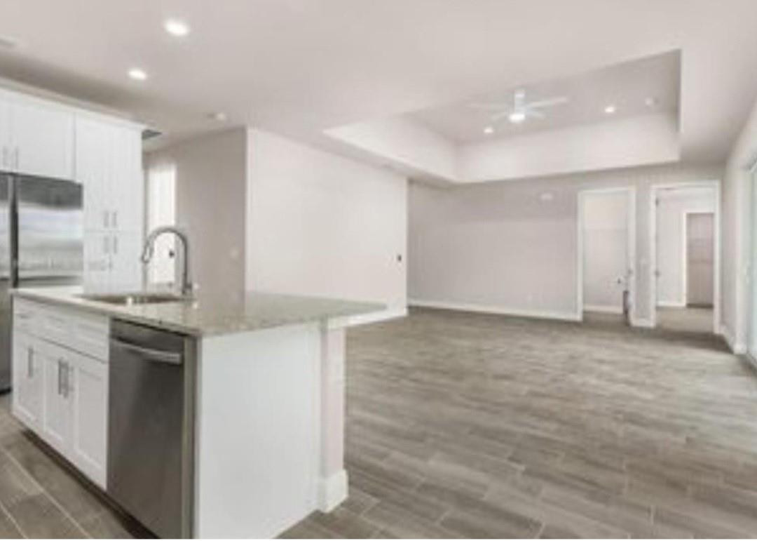 321 Neighborly Road LaBelle, FL 33935 - Photo 5 of 18 a kitchen with granite countertop a sink and a stove top oven