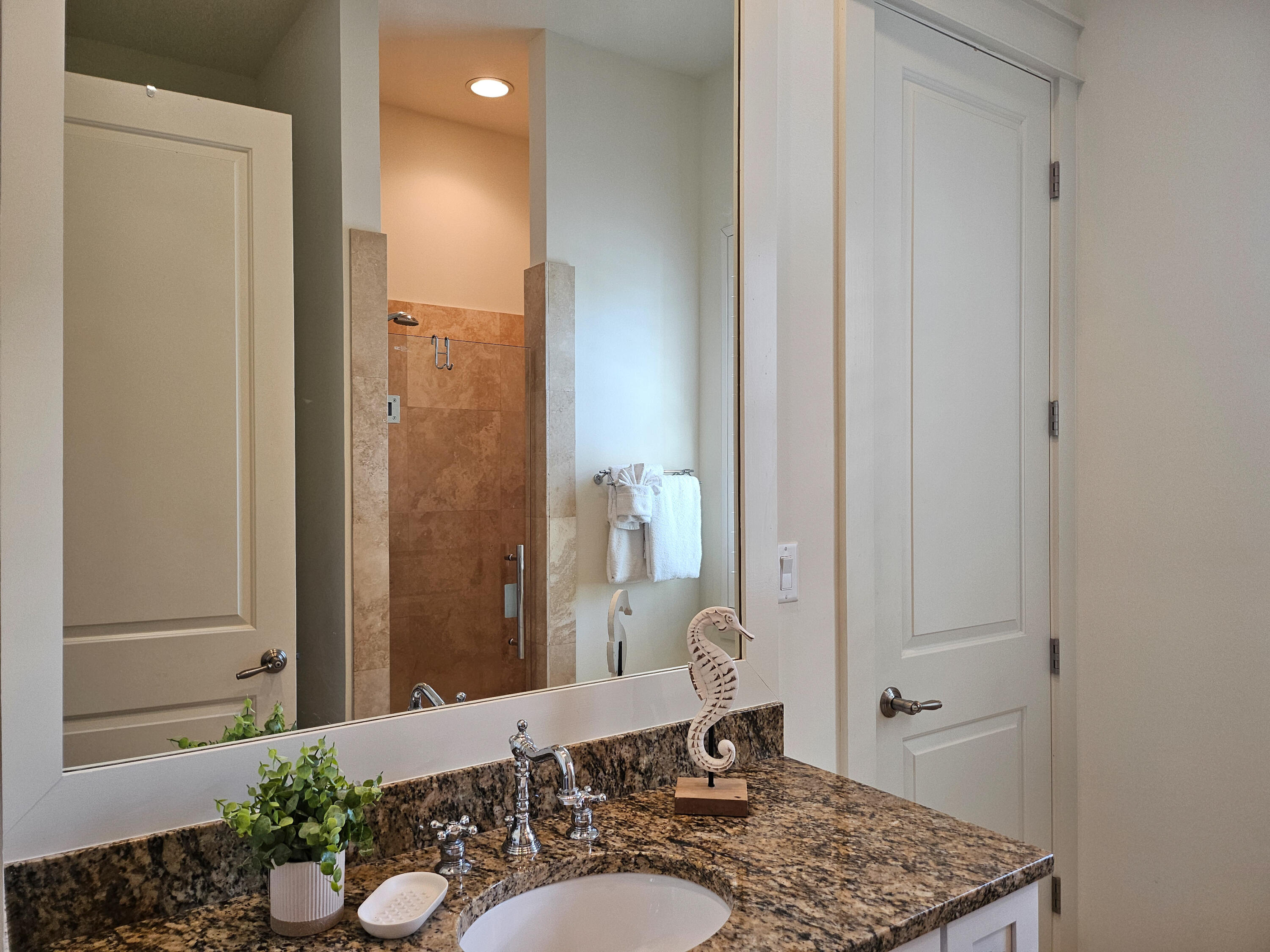 10 Gulfview Way Santa Rosa Beach, FL 32459 - Photo 27 of 40 a bathroom with a granite countertop sink and a mirror