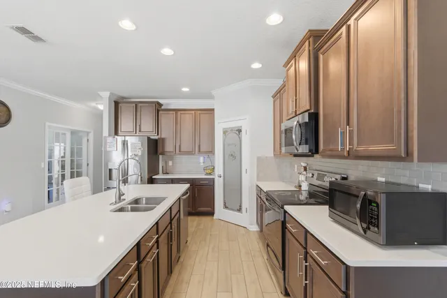 a bedroom with a bed wooden floor and window