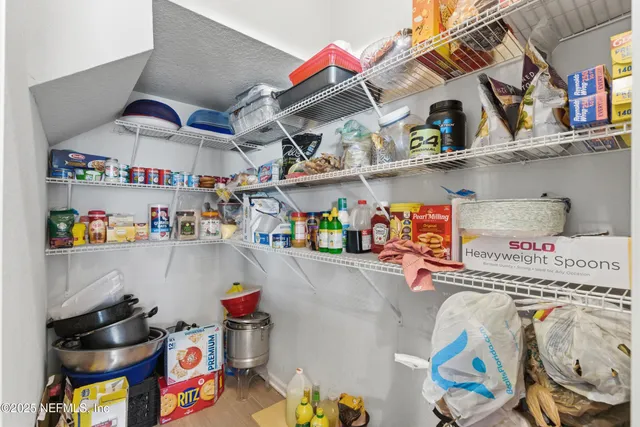 a bathroom with a shower and a sink