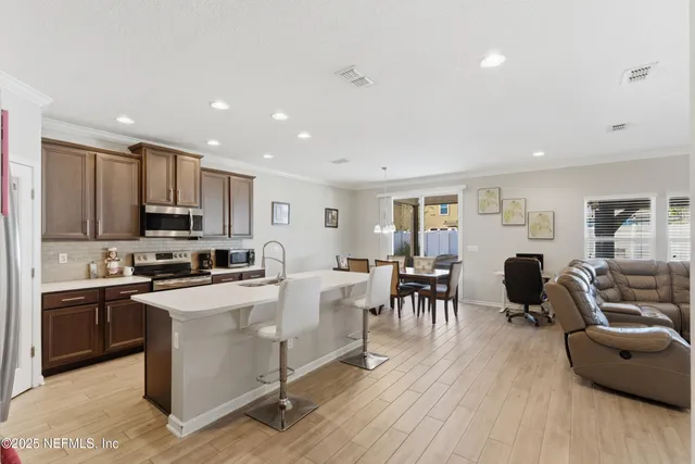 a bedroom with a bed and a potted plant