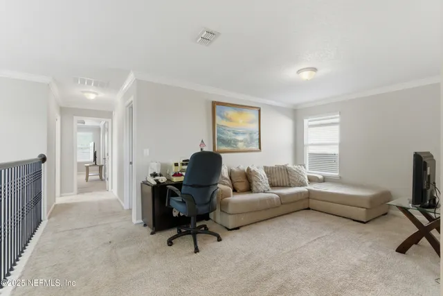 a kitchen with stainless steel appliances a refrigerator a stove a sink cabinets and a dining table with wooden floor