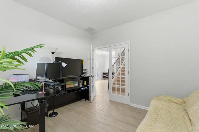 a view of a hallway with windows