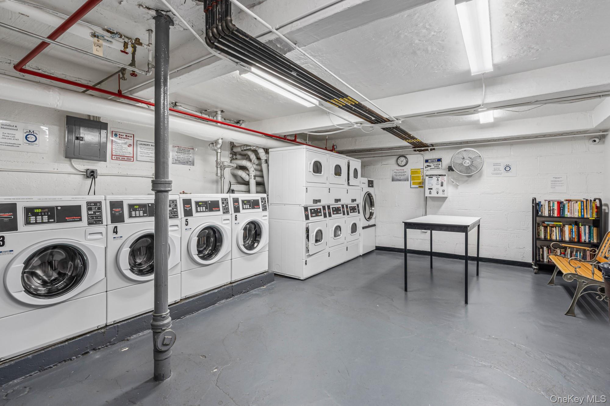 45 Kew Gardens Road, Unit 4A Queens, NY 11415 - Photo 14 of 19 a utility room with dryer and washer