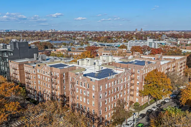 a front view of a brick house with a yard